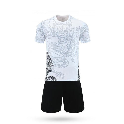 White t-shirt with dragon design and black shorts on a white background