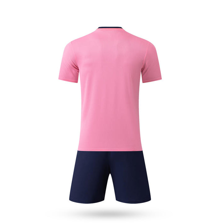 Pink sports jersey and navy shorts on a white background