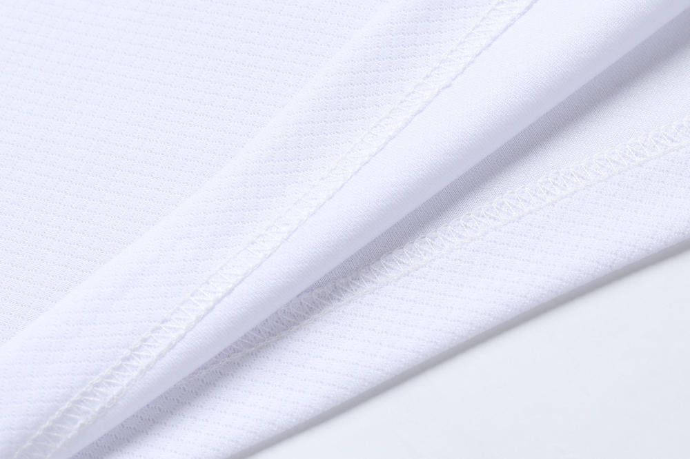 Close-up of white fabric with a subtle pattern