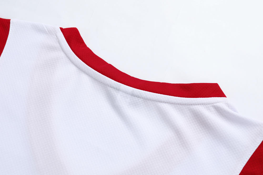 Close-up of a white shirt with red trim on a white background