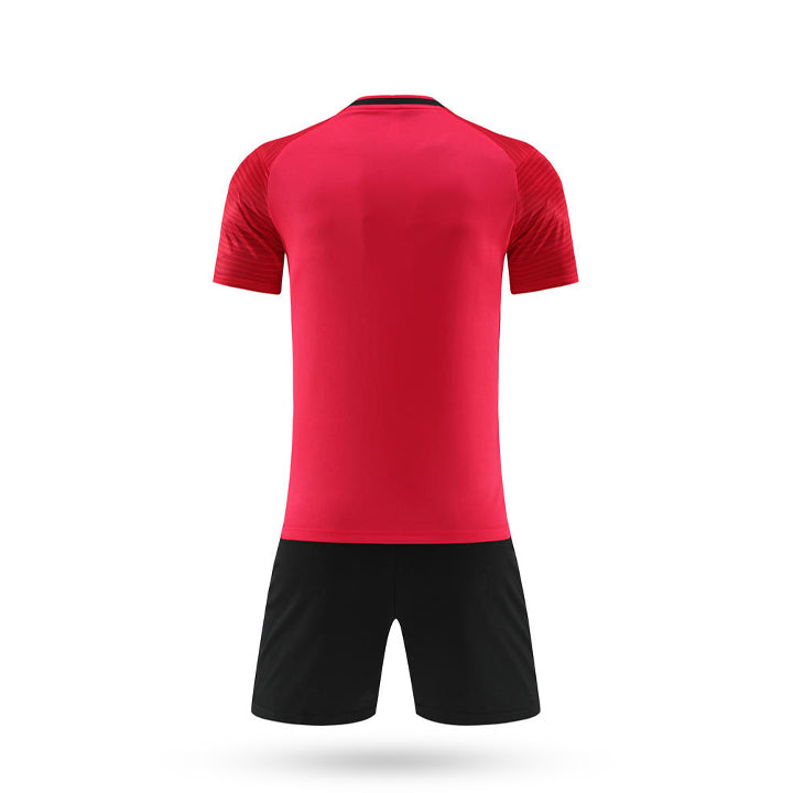 Back view of the red youth soccer jersey kit with matching black athletic shorts.
