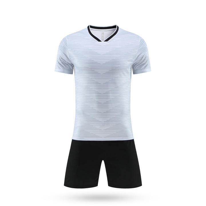 White Apex Performance Youth Soccer Jersey with light grey chevron graphics and black V-neck.