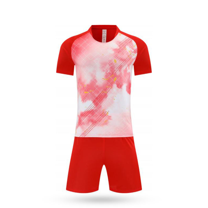 Front view of kids performance soccer kit featuring a red and white diagonal stripe jersey and red shorts.