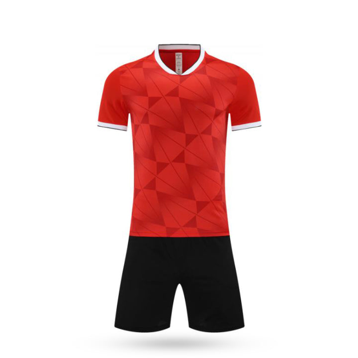 Full set view of the Phantom Rush kids soccer kit featuring a red color with black short.