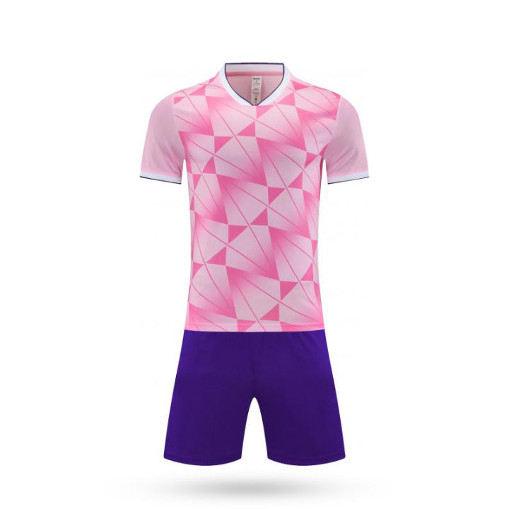 Full set view of the Phantom Rush kids soccer pink kit featuring a pink color with blue short.