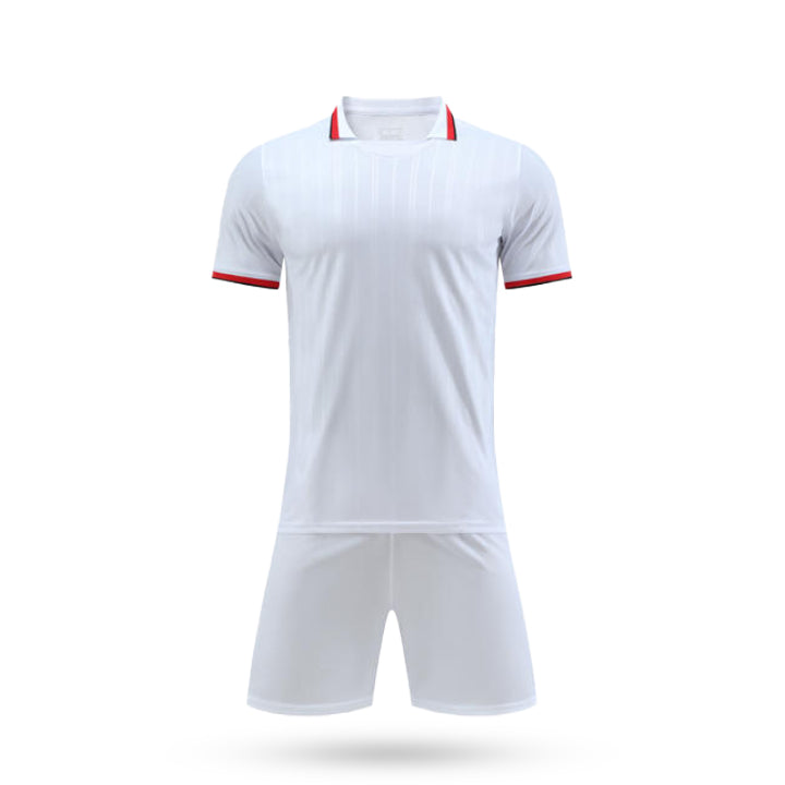 Front view of the white Pure Form soccer jersey with a red and black tipped collar and matching white shorts.