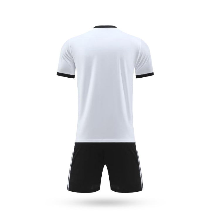 Back view of the H Pro Team Core Plain Soccer Kit featuring a clean white back on the jersey with black sleeve cuffs and solid black athletic shorts.